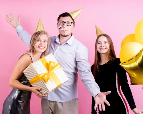 vecteezy_portrait-of-joyful-friends-celebrating-birthday-party-pink_3295352